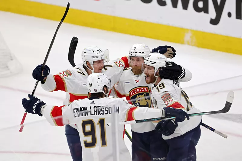 Image: Florida Panthers teammates huddle up in celebration after Sam Bennett scores a goal in Game 3 of the 2024 Stanley Cup