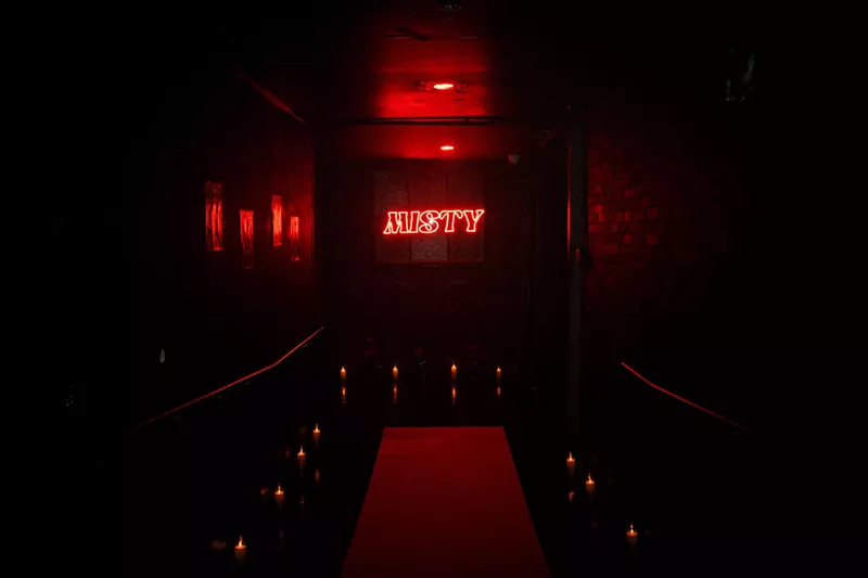 Image: Neon light featuring the My Friend Misty party logo