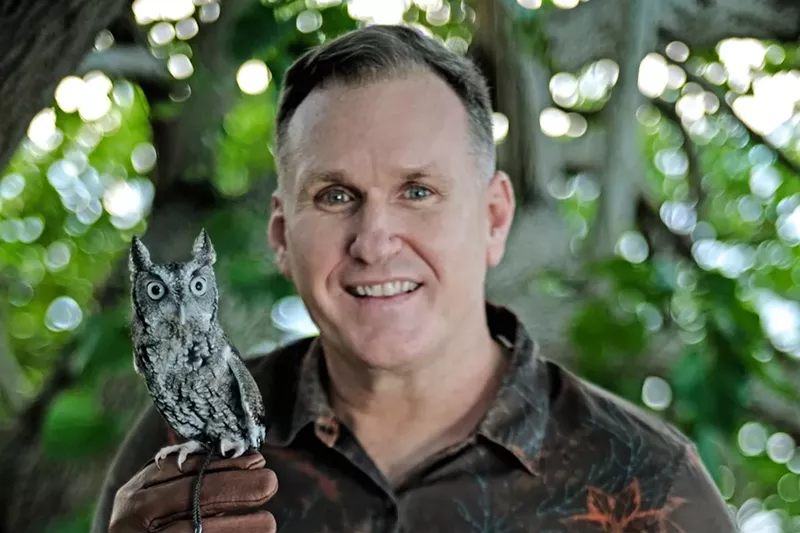 Image: Portrait of Christoper Boykin hold a small owl