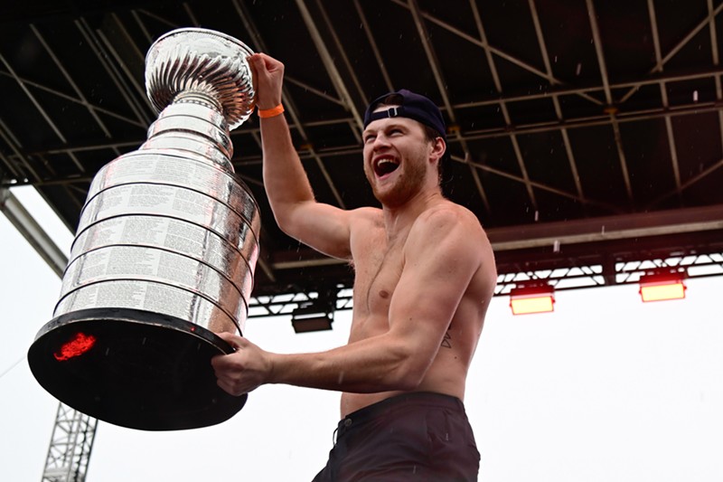 Steven Lorentz hoists the Stanley Cup trophy during the Florida Panthers' parade and rally at Fort Lauderdale Beach.