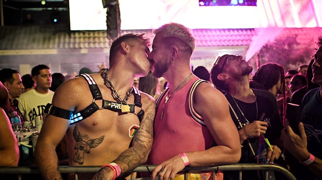 Two men kissing at the Stonewall Pride Parade
