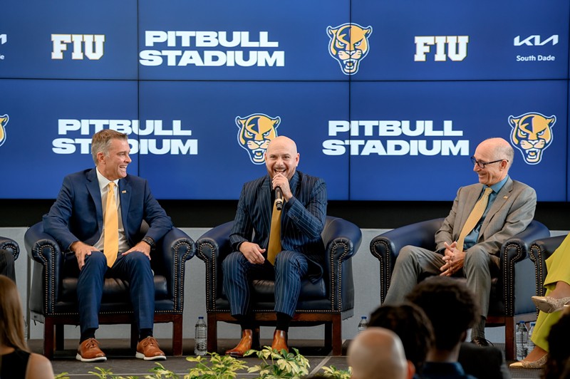 FIU athletics director Scott Carr, Pitbull, and FIU president Kenneth Jessell speak during the announcement of Pitbull Stadium on August 6.