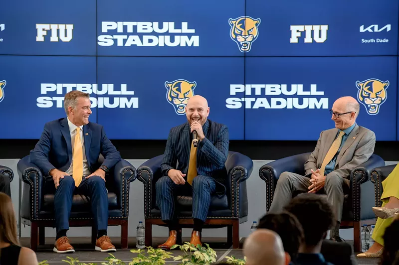 Image: FIU athletics director Scott Carr, Pitbull, and FIU president Kenneth Jessell on stage