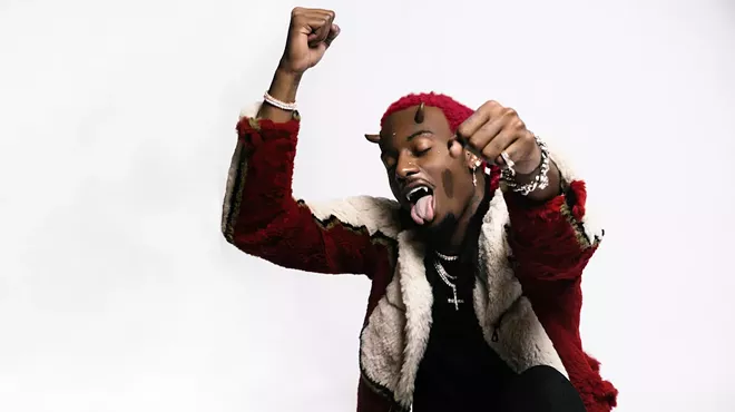 Playboy Carti with horns growing out of his forehead