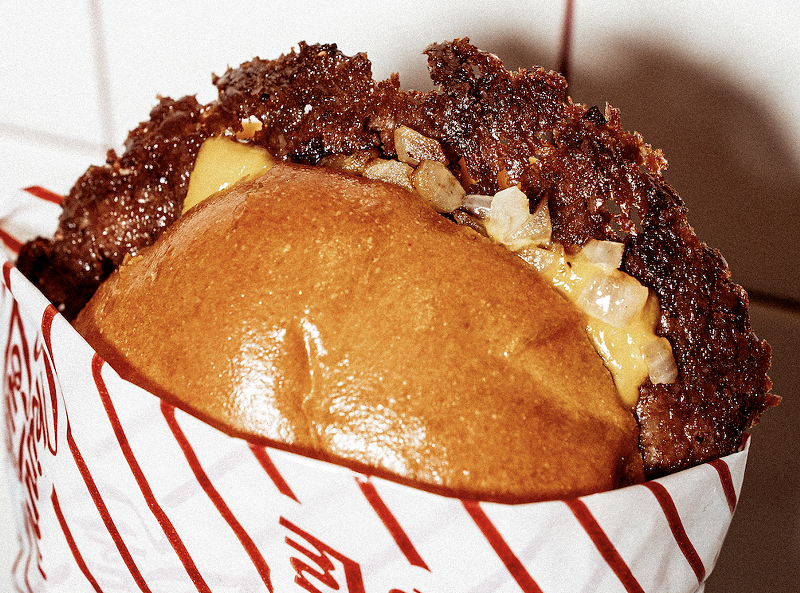 Image: A smash burger with onions