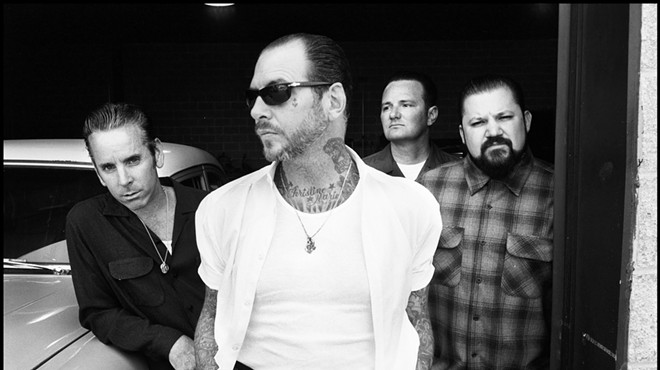 Black and white image of the four members of the punk band Social Distortion