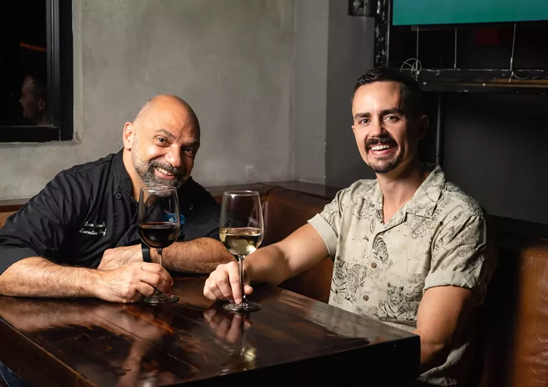 Image: Two men posing for a photo