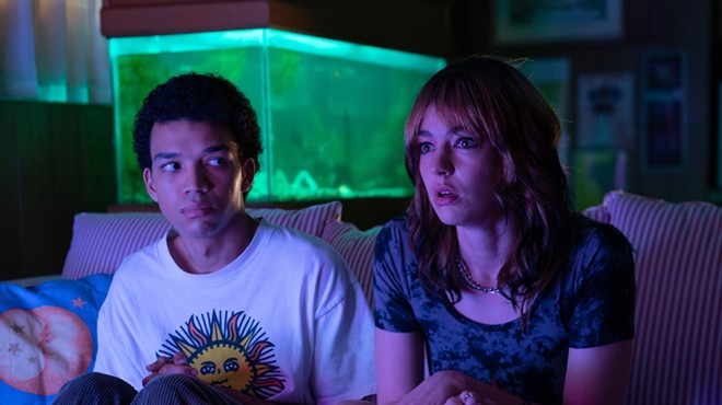 Still of Justice Smith and Brigette Lundy-Paine still on a couch
