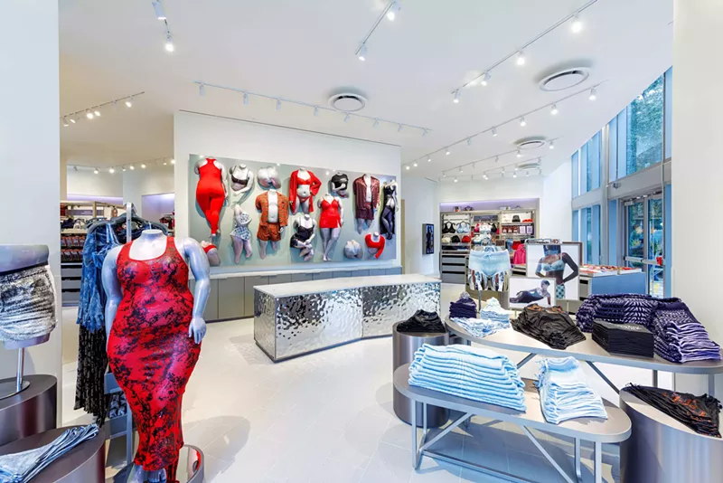 Image: Interior design of Savage X Fenty's Miami store featuring bold colors and modern decor