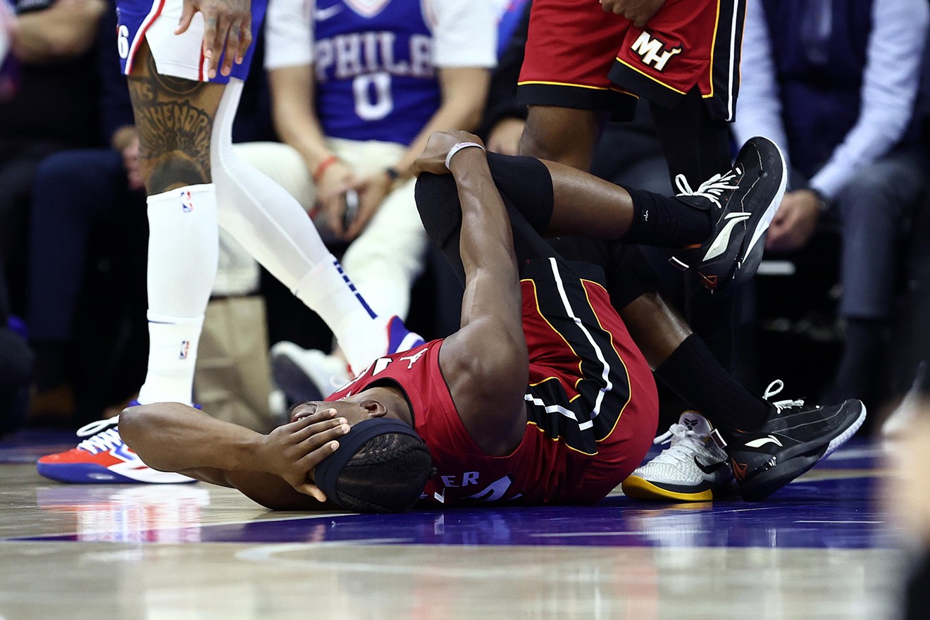 Jimmy Butler writhes in pain on the court at the Wells Fargo Center during the NBA Play-In Tournament on April 17, 2024 in Philadelphia, Pennsylvania.