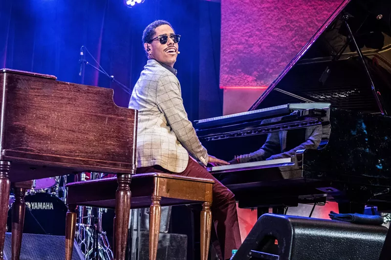 Image: Matthew Whitaker plays the piano on stage