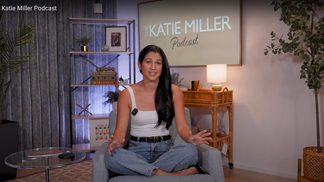 A photo of Katie Miller hosting her new podcast.