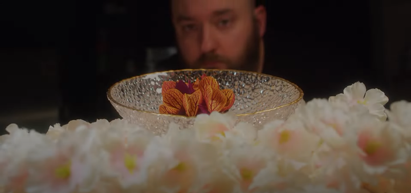 Image: Jacob Bickelhaupt looking at a dish at his restaurant, Konro.