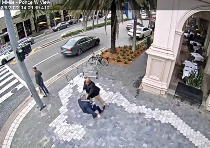 Image: Footage captured on the city's CCTV footage shows a man identified as Miami police detective Stanley Paul-Noel (bald) and Carlos "CJ" Gimenez tussling outside Morton's the Steakhouse in Coral Gables on February 9, 2022.