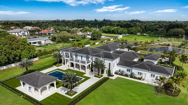 An overhead view of the estate and its 10-acre plot, including a reflecting pool and pond.