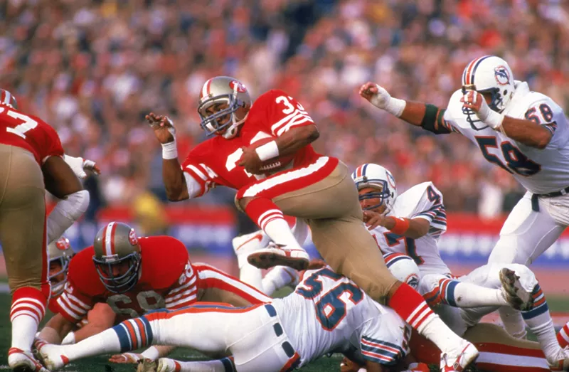 Image: San Francisco 49ers running back rushes during Super Bowl XIX in 1985