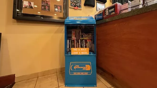 A Free Blockbuster stand inside a movie theater