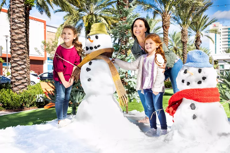 Image: Dania Pointe invites you to enjoy a simulated snow fall during the holiday season.