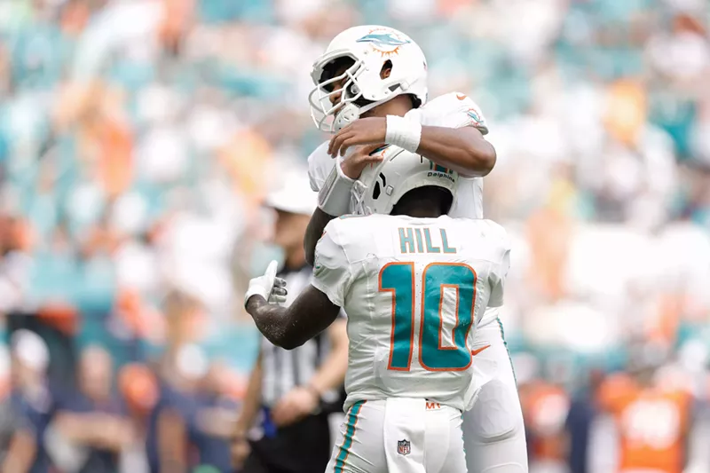 Image: Tua Tagovailoa and Tyreek Hill celebrate after a Miami Dolphins touchdown in the historic blowout of the Denver Broncos at on September 24, 2023, at Hard Rock Stadium.