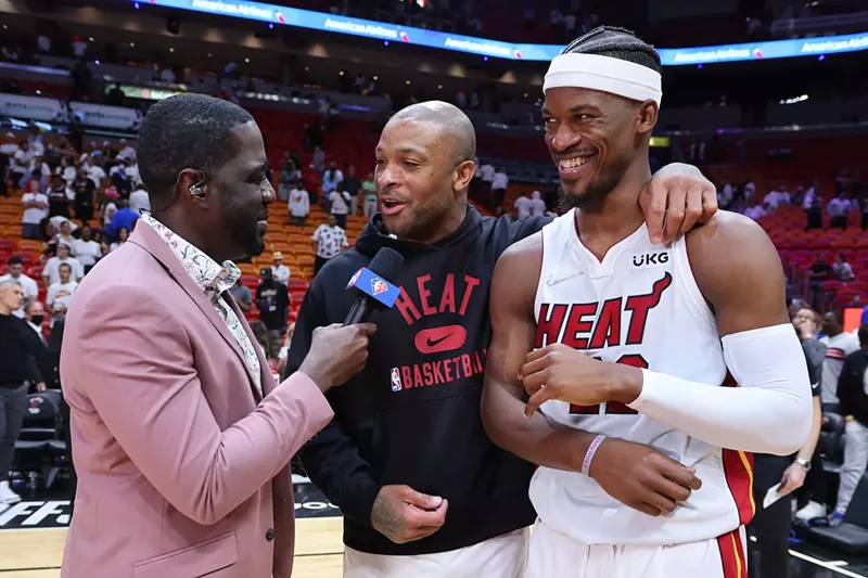 Image: Miami Heat's P.J. Tucker (center) and Jimmy Butler (right) are interviewed after beating the Philadelphia 76ers in the NBA Eastern Conference Semifinals on May 10, 2022.