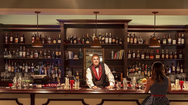 The bar at Cafe la Trova with a bartender ready to serve.