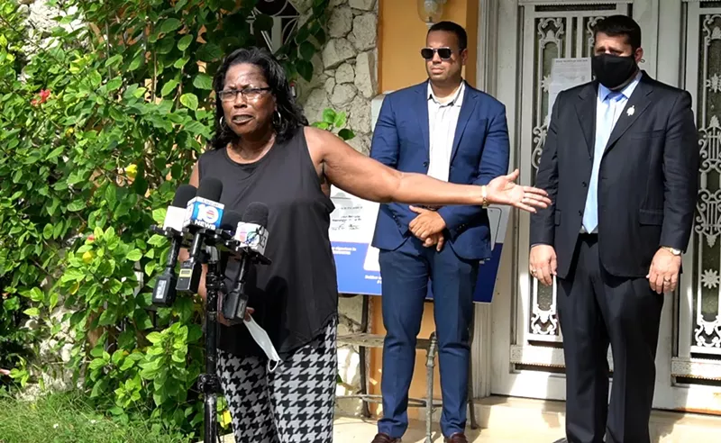 Image: Maria Williams-James (left) still lives in her foreclosed home despite a pending eviction.