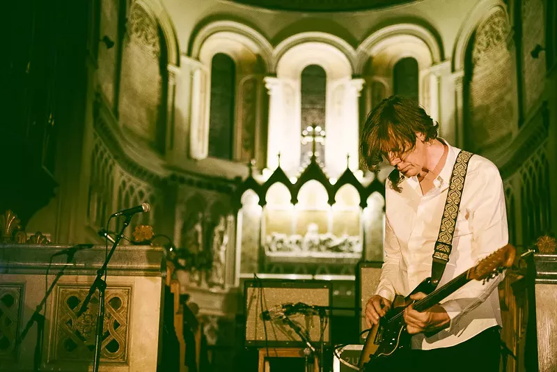 Image: Thurston Moore performing on stage