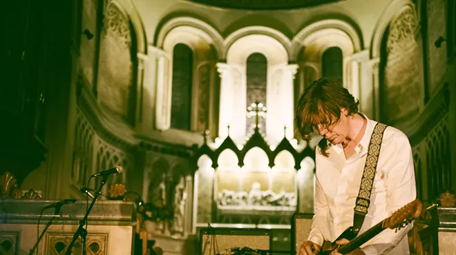 Thurston Moore performing on stage