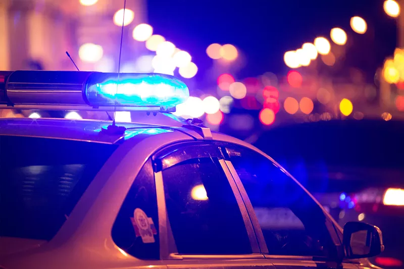Image: Stock photo of a police car with lights activated