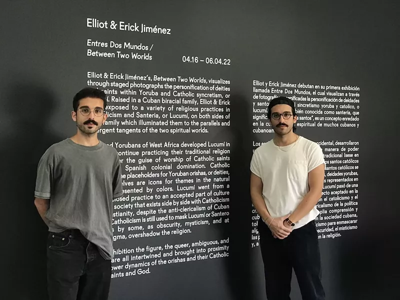 Image: Elliot and Erick Jiménez at their exhibit, "Entre Dos Mundos," at Spinello Projects.