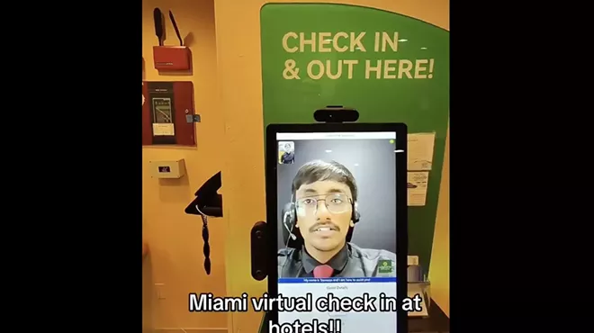 A remote receptionist talks with a guest at a Miami hotel.