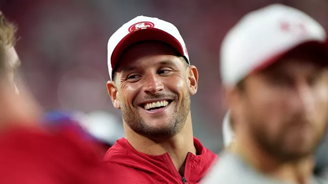 Nick Bosa of the San Francisco 49ers, clad in athleisure gear, looks on from the sidelines against the Denver Broncos in the second half during the NFL preseason game at Levi's Stadium on August 09, 2025, in Santa Clara, California.