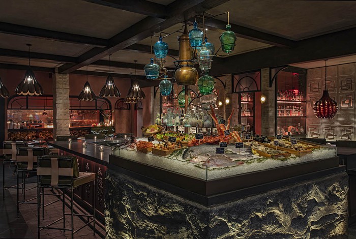 The tequila tree dispenses mezcal and tequila at the bar inside Moxy Miami South Beach's new seafood restaurant Como Como. - PHOTO BY MICHAEL KLEINBERG