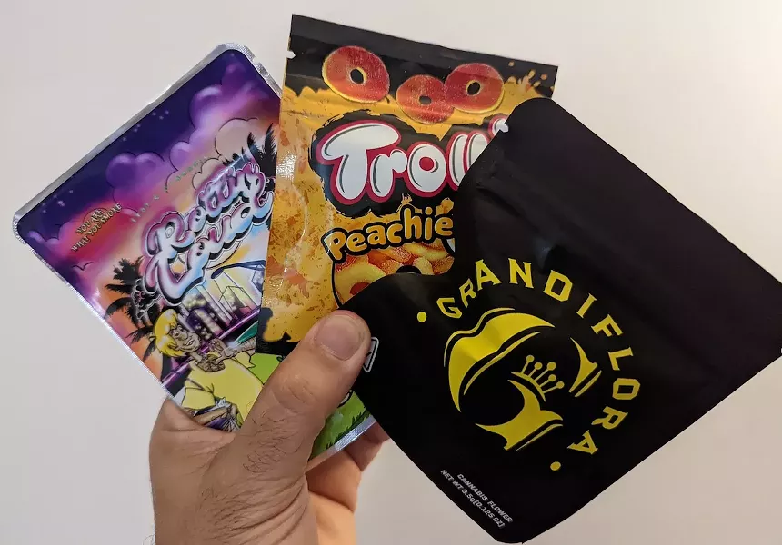 Bud and edibles packaged in branded, resealable bags at the Miami marijuana bazaar - PHOTO BY FRANCISCO ALVARADO