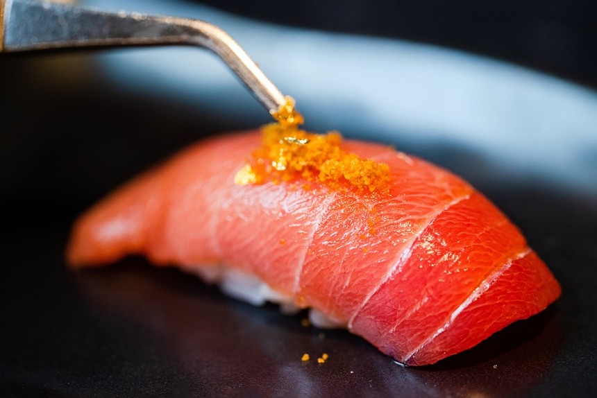 Cho-toro (medium fatty) bluefin tuna nigiri is garnished with bottarga and edible gold for extra glitter. - PHOTO COURTESY OF BLIND TIGER