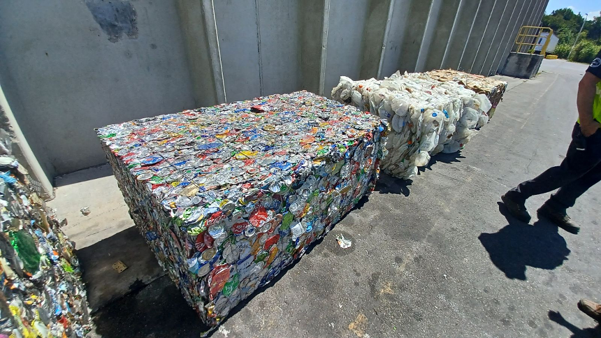 Bales of recyclables are separated by material: paper, cardboard, plastic, and aluminum. One bale can weigh over 1,000 pounds. - PHOTO BY JOSHUA CEBALLOS