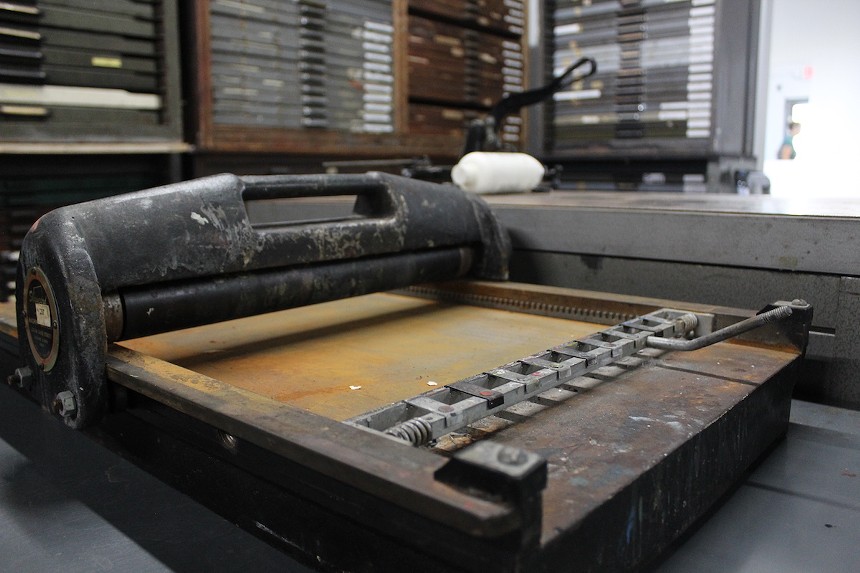 A recently rescued showcard press named Dreyfoos awaits restoration. - PHOTO BY JESSE FRAGA