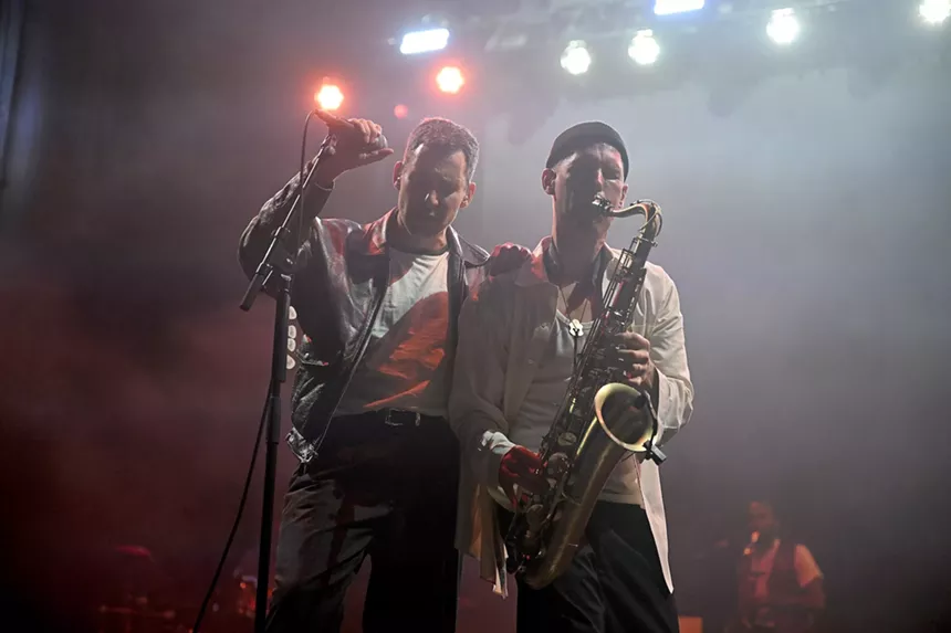 Bleachers members Jack Antonoff and Evan Smith performing on stage at the Riptide Music Festival on Fort Lauderdale Beach.