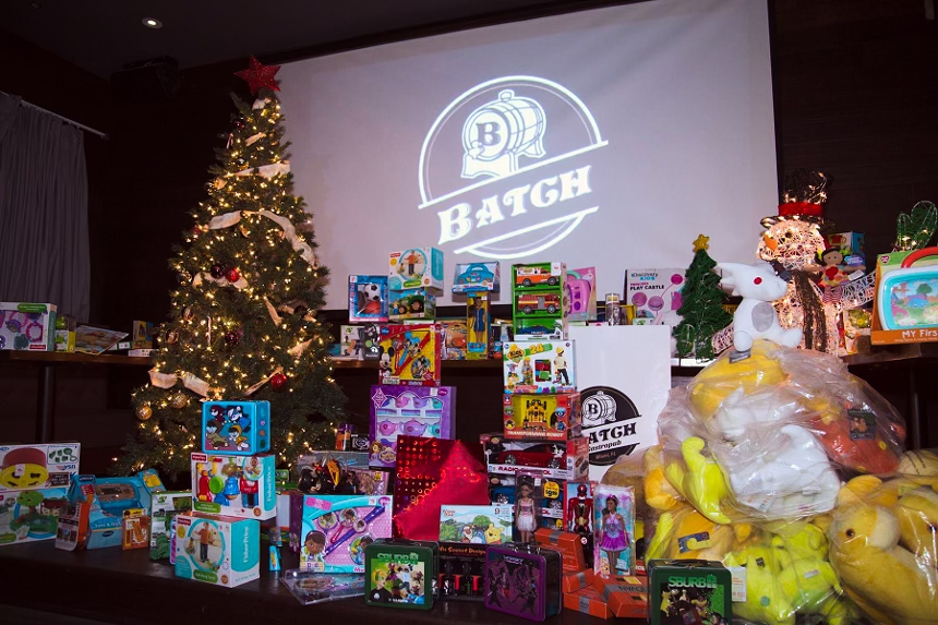 Piles of toys and a Christmas tree fill a room at Batch Gastropub in Brickell.