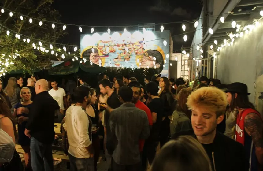 A crowded Wood Tavern at its original location in Wynwood.