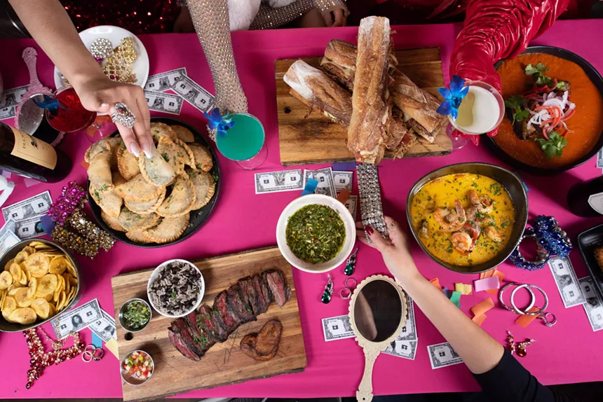 Dishes served on a pink table at R House