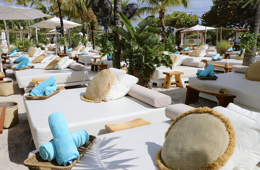 Beach cabana beds with blue towels