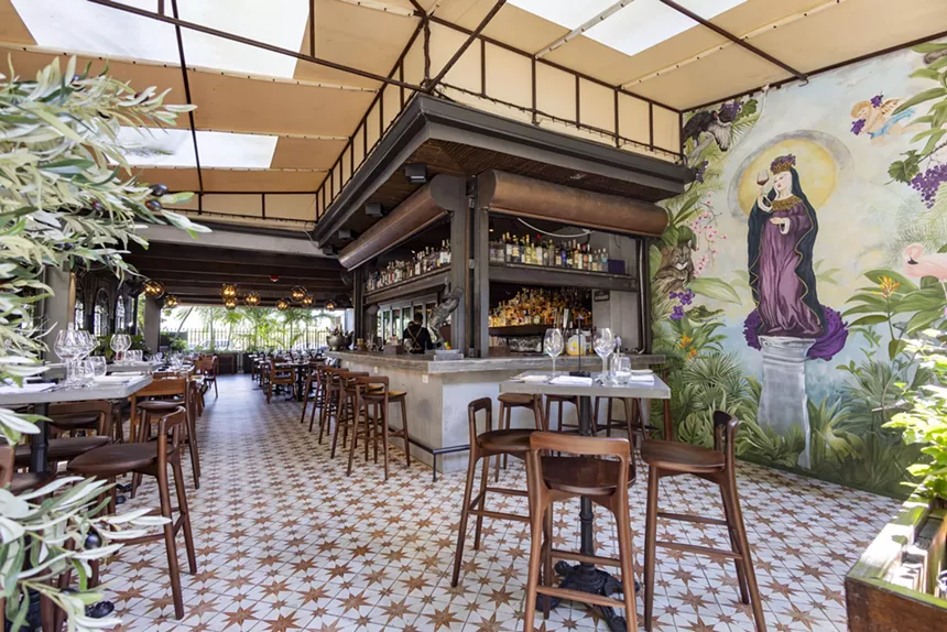 Indoor-outdoor seating and a mural