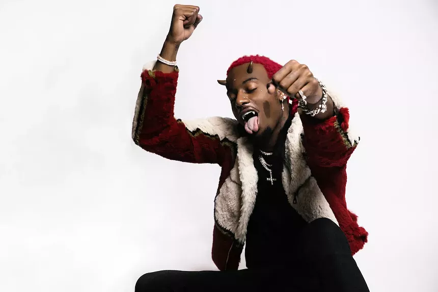 Playboy Carti with horns growing out of his forehead
