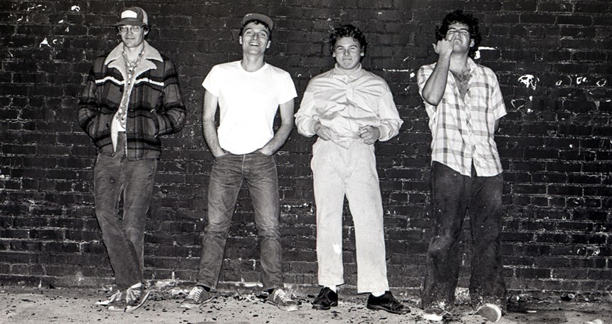 Black and white photos of the members of the Descendents standing against a wall