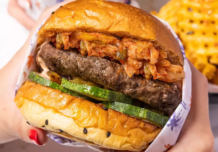 Closeup of a burger with toppings