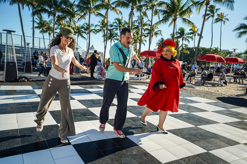 Three people dancing at Lummus Park in Miami Beach