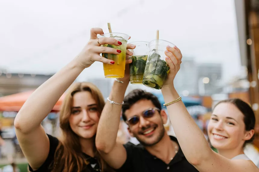 People cheering cocktails