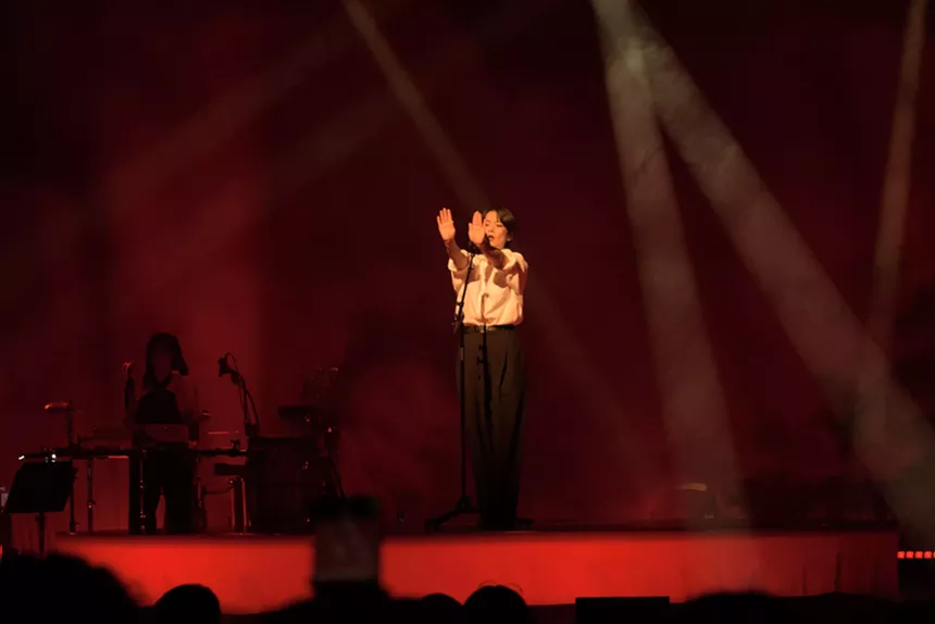 Mitski performing on stage