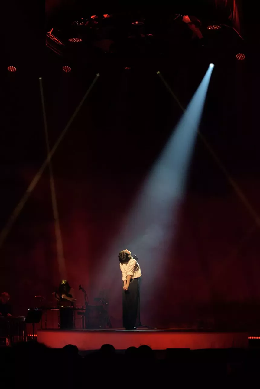 Mitski performing on stage